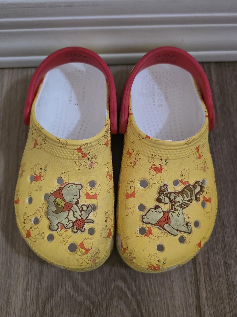 CROCS Kids Yellow Winnie the Pooh Slip-On Clogs with Pink Heel Strap